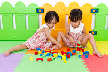 Asian Little Chinese Girls Playing Wooden Blocks