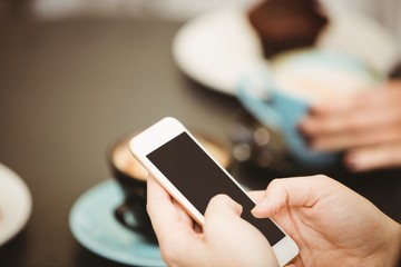 Friends looking at smartphone