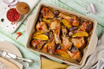 Oven-roasted orange chicken with red onion