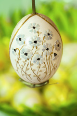 Close up od decorative Easter egg on green background