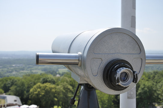 View of the city of Krakow (Poland) and a coin operated telescope on bright sunny day