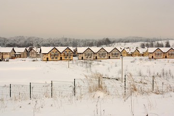 Fototapeta na wymiar small cottege houses as toys in winter