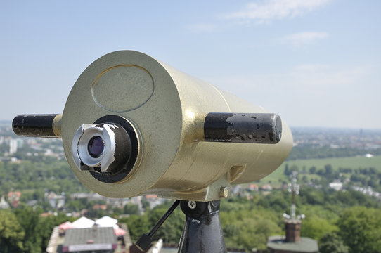View of the city of Krakow (Poland) and a coin operated telescope on bright sunny day
