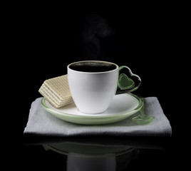 white Cup of coffee and waffles isolated on dark background