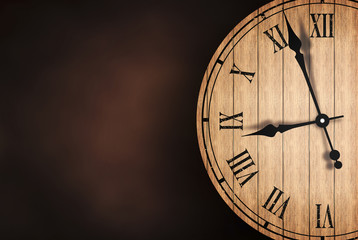 Grunge old vintage clock with brick wall background