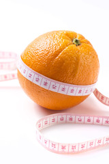 Weight losing concept with orange on white background
