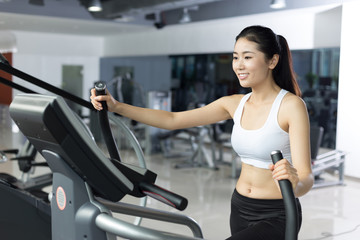 beautiful girl working out in modern gym