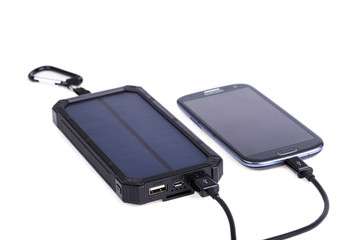 Portable solar charger for smart phone. © garry_images