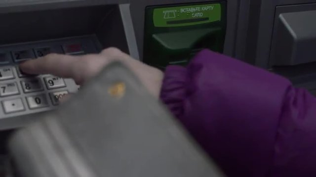 Women Cash-in Money Into The ATM