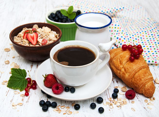 Fresh berries, coffee and croissant
