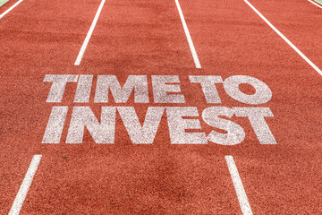 Time To Invest written on running track