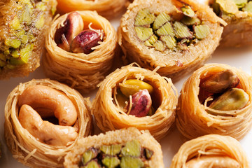 Oriental sweets with nuts in assortment close-up macro