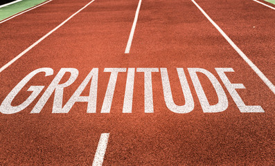 Gratitude written on running track