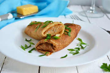 Delicate pancake stuffed with mushrooms and cheese