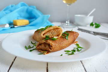 Delicate pancake stuffed with mushrooms and cheese