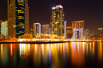 Dubai marina in a summer night panorama of skyscrapers