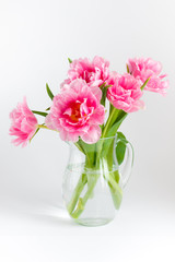 Pink tulips in a glass jar