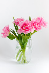 Fototapeta na wymiar Pink tulips in a glass jar