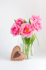 Pink tulips in a glass jar