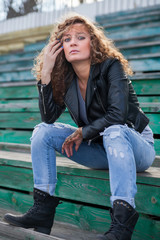 Beautiful girl sitting on   tribune