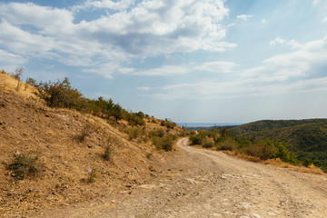 Old sand road at the mountains