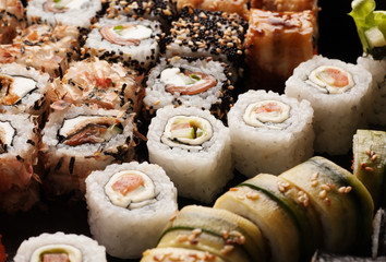Assortment of sushi rolls set closeup macro shot