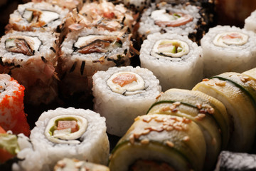 Assortment of sushi rolls set closeup macro shot
