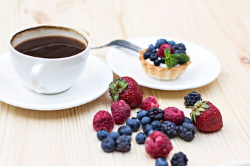 Tart  with Fresh berries - dessert on wooden table close up
