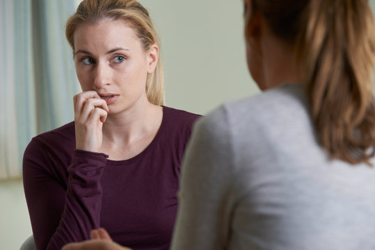 Young Woman Discussing Problems With Counselor