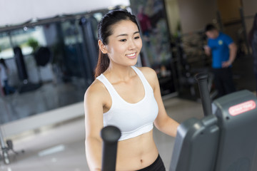 beautiful girl working out in modern gym