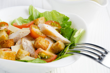 Caesar salad with sauce closeup
