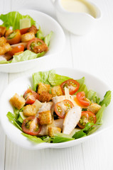 Two plates of caesar salad