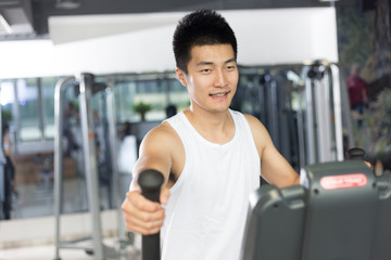 young man working out in modern gym