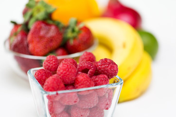 close up of fresh raspberry and fruits on table