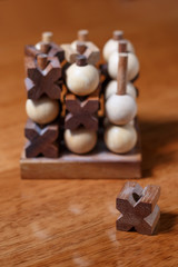 tic-tac-toe or noughts and crosses game  in wooden stick standing