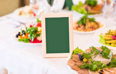 Place setting and card on a table at a reception
