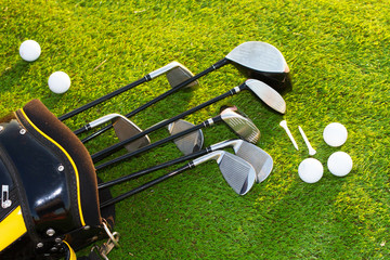 Golf club and Golf ball in bag on grass