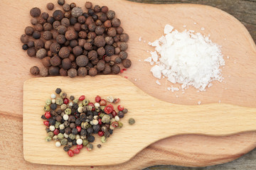 Various seasonings on wooden background