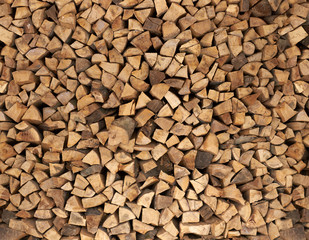 Dry firewood in a pile for furnace kindling
