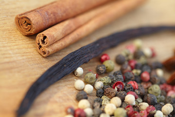 Various seasonings on wooden background