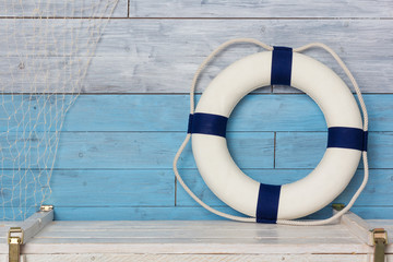 life buoy on wood background blue and white