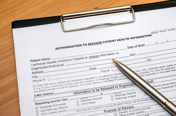 Medical history document with pen on table