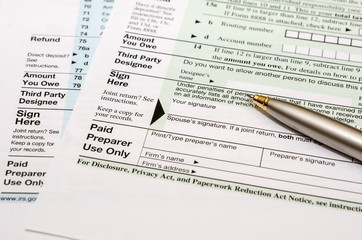 blank tax form with pen
