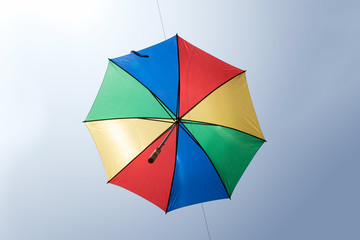 Close up umbrella is Blue green yellow red color