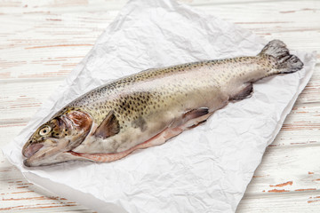 Fresh trout on white wood