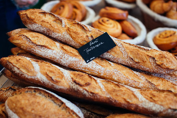 Four baguette bread loaves. Food background.