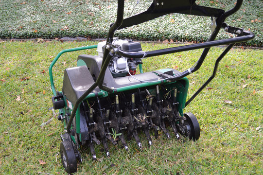 Lawn aeration machine with grass plug stuck in the stem