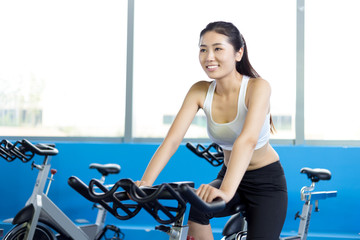 beautiful girl working out in modern gym