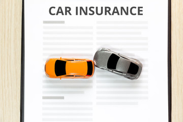 Top view of Accident toy car with toy car insurance.