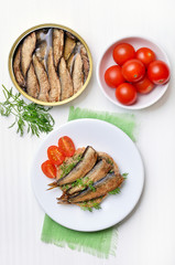 Sprats sandwich and tomatoes